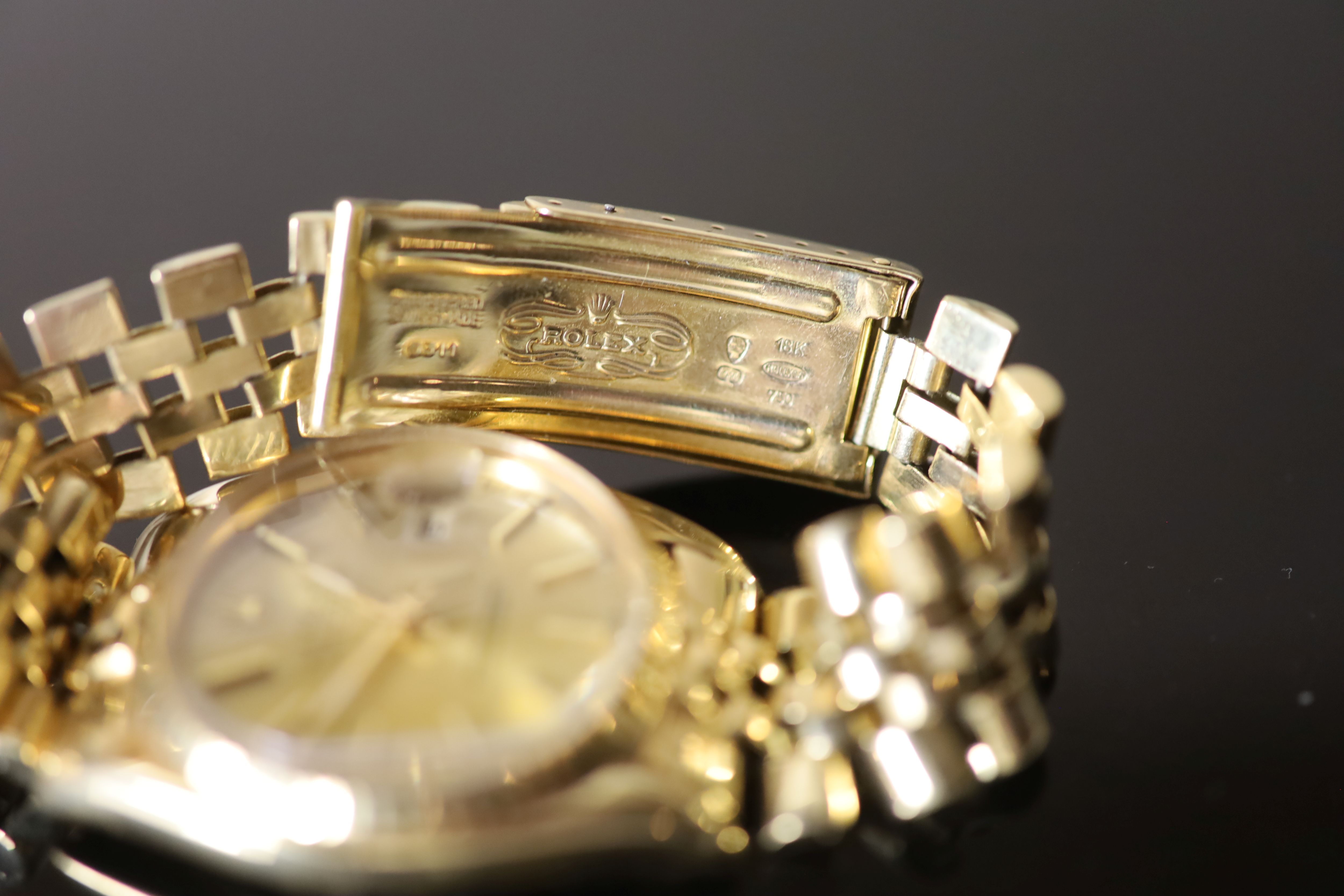 A gentlemans 1990s? 18k gold Rolex Oyster Perpetual Datejust wrist watch, on a 18k gold Rolex bracelet,